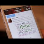 Andrea Shaw's Twitter account showing on a phone screen
