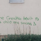 Graffiti saying 'the creative adult is a child who survived'