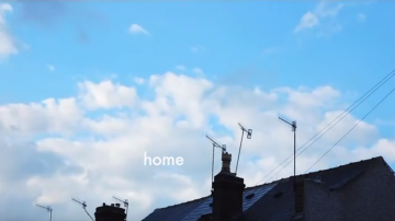 A rooftop and sky