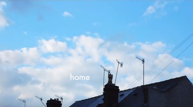 A rooftop and sky