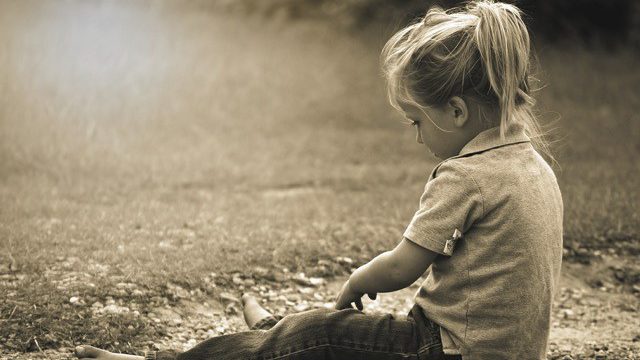 Little girl on grass
