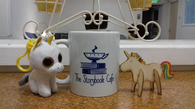 A coffee cup and some cupcakes