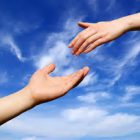hand reaching out for hand