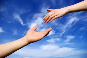 hand reaching out for hand