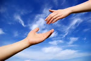 hand reaching out for hand