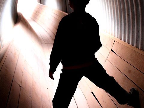 A boy in a tunnel