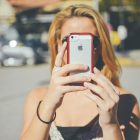 Girl using cameraphone