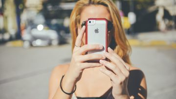 Girl using cameraphone