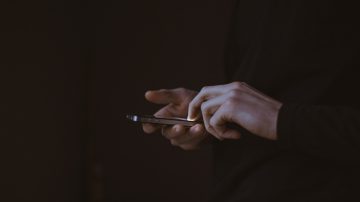 someone using a mobile phone