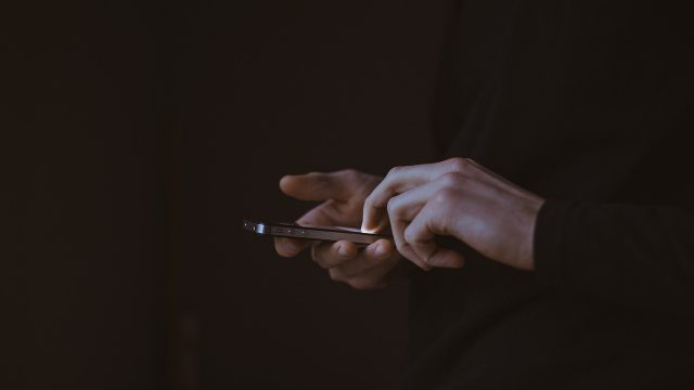 someone using a mobile phone