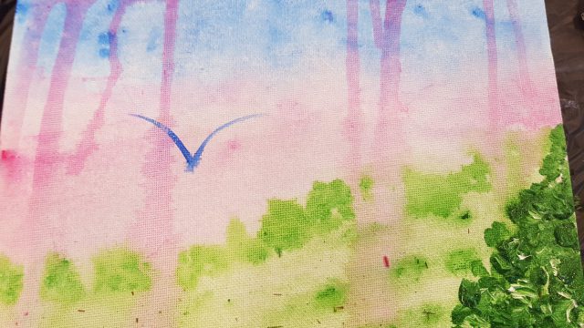 purple: beautiful watercolour of a bird flying high in a purpley sky over trees and fields