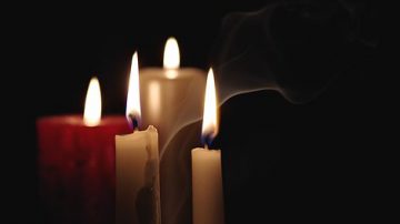 candles burning in the darkness