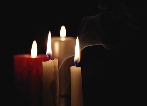 candles burning in the darkness