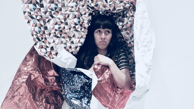 woman wrapped in paper